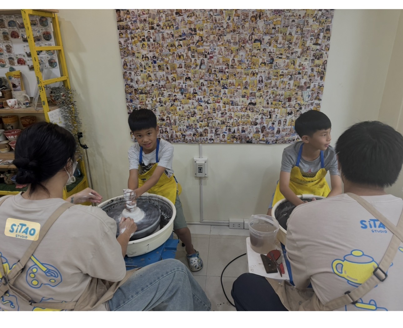 Aden and Andrew creating pottery together
